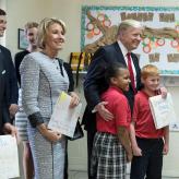 President Donald Trump and U.S. Secretary of Education Betsy DeVos poses for a photo with students of Saint Andrew Catholic School on March 3, 2017.