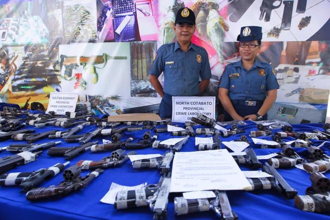 Seized firearms on display during a visit by Duterte at the Police Regional Office in General Santos City