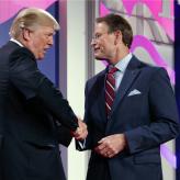 Donald Trump shakes hands with Family Research Council president Tony Perkins at the 2017 Value Voters Summit, Friday, Oct. 13, 2017, in Washington.