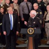 U.S President Donald Trump and Vice President Mike Pence look on as Sheriff Thomas Hodgson of Bristol County Massachusetts delivers remarks in the East Room of the White House September 5, 2018 in Washington, DC.