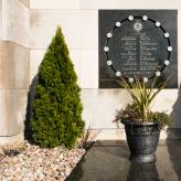 Plaque on the exterior wall of École Polytechnique commemorating the victims of the massacre. (Photo: Josie Desmarais)