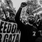 Black and white photo of protesters with raised fists