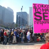 A person holding a sign that reads "I choose to have sex responsibly"