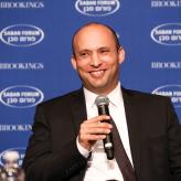 Man holding microphone and smiling