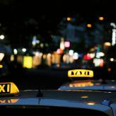 shallow focus photography of Taxi signage