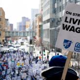 A sign that says "On strike for living wages"