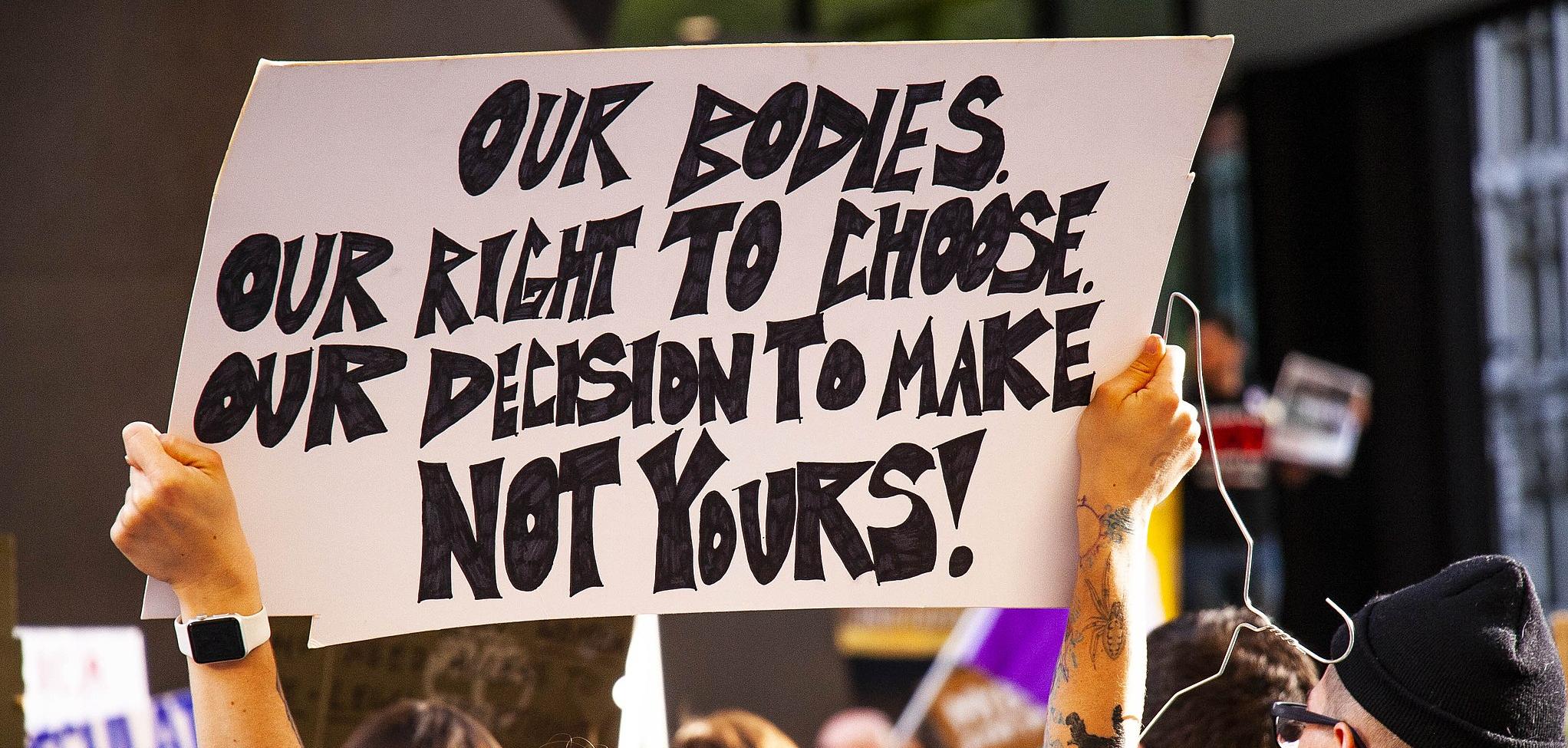 Protester at Rally for Reproductive Rights Chicago Illinois, sign says: Our Bodies, Our Right to Choose, Our Decision to make not yours!"