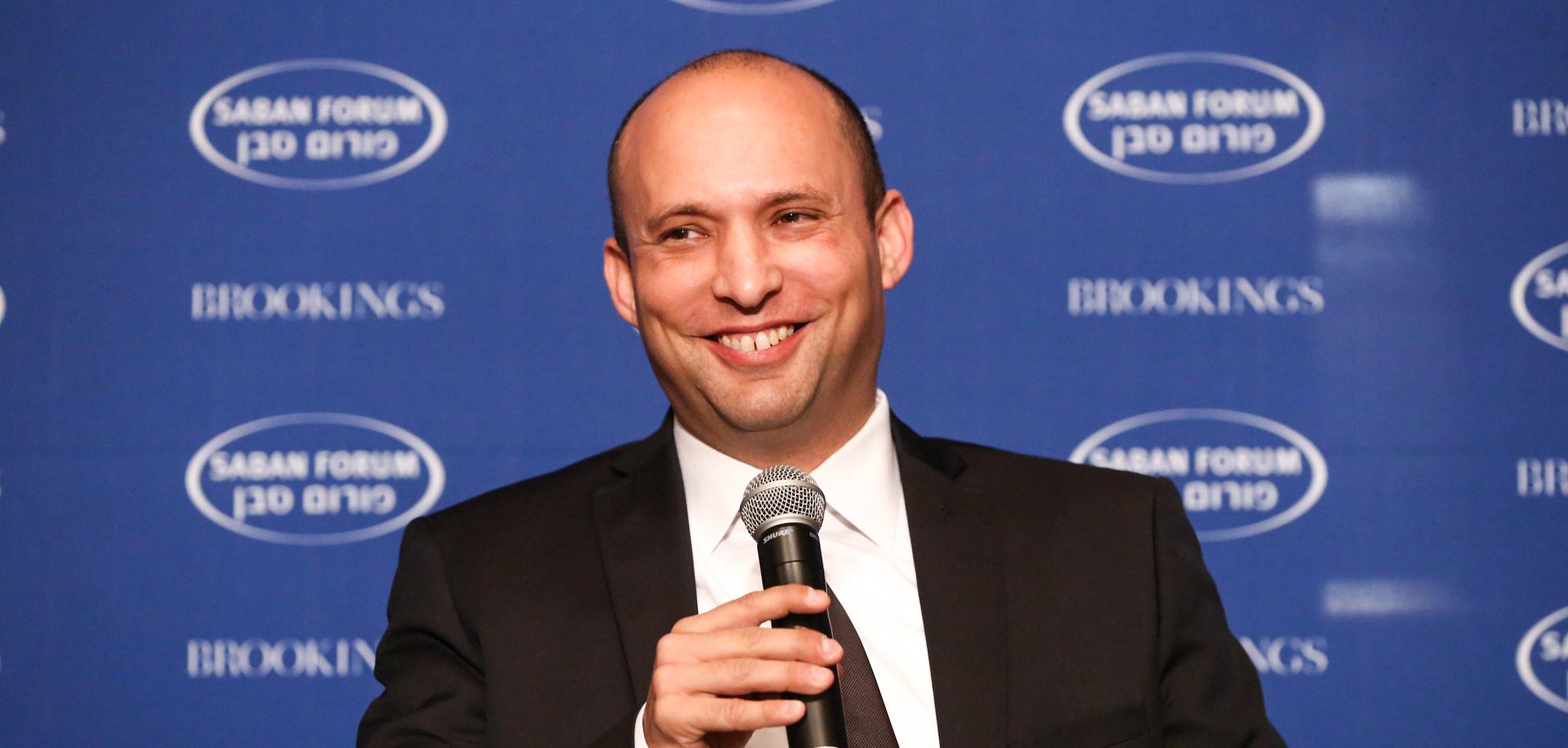 Man holding microphone and smiling